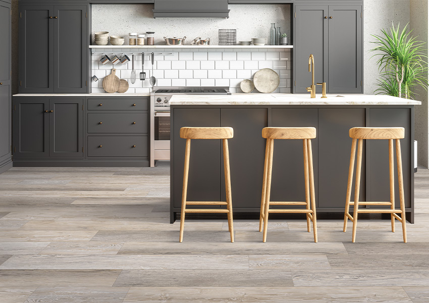 luxury vinyl plank flooring in kitchen with brown cabinets